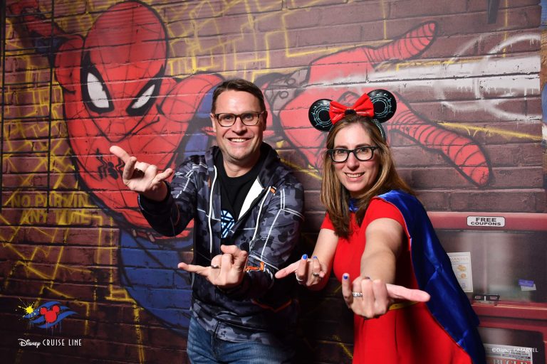 Disney Cruise Tips For First-Timers. What new Disney Cruise Line cruisers need to know before booking a voyage. Brian and Sam from DCL Duo pose in superhero stances in front of a Spider-Man graffiti mural during a Marvel-themed character experience. This fun onboard photo highlights one of the interactive activities featured in Disney cruise tips for first timers.